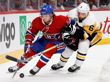 Pittsburgh Penguins defenceman Trevor Daley ties up Montreal Canadiens right wing Sven Andrighetto during NHL action at the Bell Centre in Montreal on Wednesday January 18, 2017.