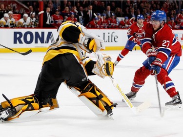 Pittsburgh Penguins goalie Matt Murray plays the puck to prevent Montreal Canadiens centre Alex Galchenyuk from getting a breakaway during NHL action at the Bell Centre in Montreal on Wednesday January 18, 2017.