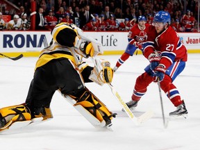 Pittsburgh Penguins goalie Matt Murray plays the puck to prevent Montreal Canadiens centre Alex Galchenyuk from getting a break away during NHL action at the Bell Centre in Montreal on Wednesday January 18, 2017.