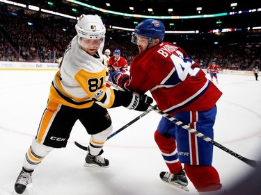 Pittsburgh Penguins right wing Phil Kessel ties up Montreal Canadiens right wing Sven Andrighetto during NHL action at the Bell Centre in Montreal on Wednesday January 18, 2017.