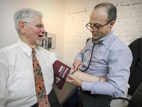 Dr. Antonio Vigano consults patient Gilles Richard at the Santé Cannabis medical clinic in Montreal. The clinic is launching a clinical trial in hopes of having medicinal marijuana recognized as pain medication and covered by insurance companies.