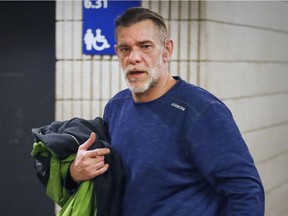 Richard Trottier leaves court during lunch break in his trial for attempted murder in Montreal on Friday, Jan. 20, 2017.  Trottier allegedly threw  his girlfriend off a third-floor balcony.