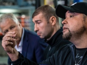 Boxer Lucian Bute, centre, promoter Yvon Michel, left, and strength and conditioning coach Angel Heredia spoke to the media at the Grant Brothers Boxing Gym in Montreal, on Monday, January 23, 2017 about the failed doping test by Bute.