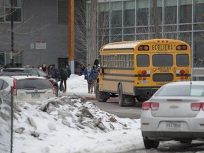 students leave Chêne-Blue High School after police secured the school during a lockdown, following reports of an armed student in Pincourt west of Montreal, on Monday, January 23, 2017.