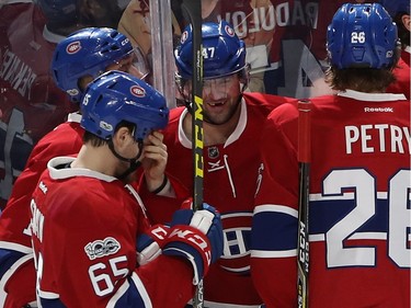 Montreal Canadiens' Alexander Radulov (47) celebrates his goal with teammates Andrew Shaw (65), Tomas Plekanec (14) and Jeff Petry (26) during third period NHL action in Montreal on Tuesday January 24, 2017.