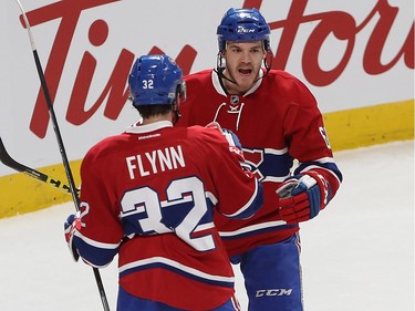 Montreal Canadiens' Andrew Shaw (65) celebrates his goal with teammate Brian Flynn (32) during first period NHL action in Montreal on Tuesday January 24, 2017.