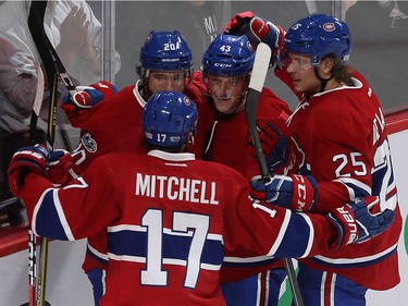 Montreal Canadiens' Daniel Carr (43) celebrates his goal with teammates Torrey Mitchell (17), Zach Redmond (20) and  Jacob De La Rose (25) during third period NHL action in Montreal on Tuesday January 24, 2017.