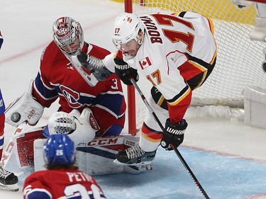 Canadiens goalie Carey Price upends Flames' Lance Bouma (17) as he slides into the crease during third period at the Bell Centre on Tuesday January 24, 2017.