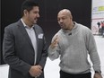 Alouettes quarterback coach Anthony Calvillo, left, and boxer Otis Grant, share a few thoughts while attending the Heads Up concussion conference at McGill University on Friday, Jan. 27, 2017.
