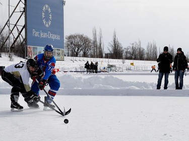 Players from the Pickup, left, and the Nordiques take part in the Classique Montrealaise outdoor hockey tournament on Sunday, Jan. 29, 2017, on the Olympic Basin in Jean-Drapeau Park.