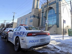 A police car is parked outside the Islamic Centre of Quebec in St-Laurent on Monday, Jan. 30, 2017. In light of the Quebec City shooting, the Muslim Council of Montreal is asking police to be more proactive with individuals showing signs of extremism online.