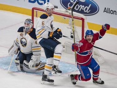 Montreal Canadiens centre Andrew Shaw, right, celebrates a goal by teammate David Desharnais, not pictured, as Buffalo Sabres goalie Robin Lehner, left, and Buffalo Sabres defenceman Cody Franson, centre, look on during the second period of their NHL hockey match in Montreal on Tuesday, Jan. 31, 2017.