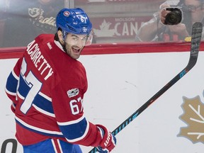 Montreal Canadiens left wing Max Pacioretty smiles after scoring his third goal against the Buffalo Sabres during the third period of their NHL hockey match in Montreal on Tuesday, Jan. 31, 2017.