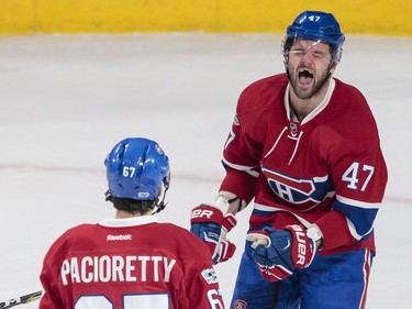 Montreal Canadiens right wing Alexander Radulov, right, celebrates the goal by teammate Max Pacioretty, left, against the Buffalo Sabres during the second period of their NHL hockey match in Montreal on Tuesday, Jan. 31, 2017.