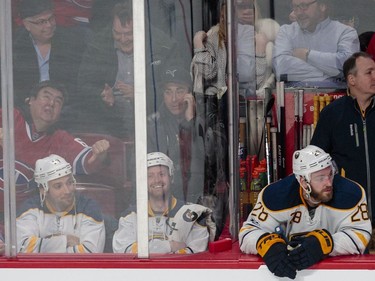Fans, Wilder Weir, left, and Craig Klinkhoff sit in Buffalo Sabres jerseys alongside the Sabres' bench during the second period of their NHL hockey match against the Montreal Canadiens in Montreal on Tuesday, January 31, 2017. They repeated a gag they performed a year ago in the same seats.
