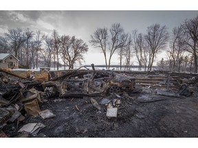 With a burned out car in the front, nothing else remains of a home at 70 Main St., in Hudson.