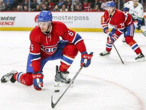 Montreal Canadiens' Shea Weber, left, with defence partner Alexei Emelin, blocks a centring pass during second period of National Hockey League game against the Vancouver Canucks in Montreal on Nov. 2, 2016.