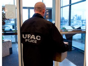 Investigators from UPAC.