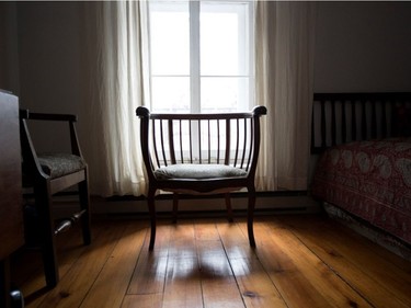 A chair used for meditation stands in a second-floor window in the home of Victoria Block in Montreal.