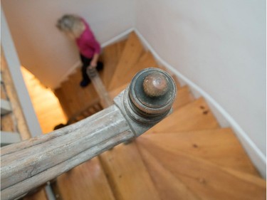 Victoria Block walks down the staircase in her Montreal home.