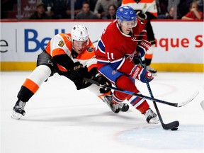 Philadelphia Flyers defenseman Ivan Provorov, left, tries to stop Montreal Canadiens right wing Brendan Gallagher from getting a shot on Philadelphia Flyers goalie Michal Neuvirth during NHL action at the Bell Centre in Montreal on Saturday November 5, 2016.