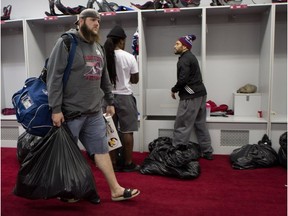 Montreal Alouettes tackle Jeff Perrett leaves after clearing out his locker in Montreal on Nov. 9, 2015.