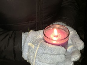 More than 200 people attended a vigil at the Dorval Mosque, Jan. 30, 2017. Some stood outside with candles, singing softly. Others crammed into the mosque and listened to speeches.