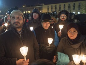 Hundreds of people attend a vigil in Montreal on Monday.