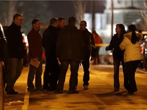 People believed to be FBI agents are seen outside of a home believed to be inhabited by possible family members of the suspect in the shooting at the Fort Lauderdale-Hollywood International Airport, Friday, Jan. 6, 2017, in Union City, N.J.