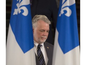 Quebec Premier Philippe Couillard arrives at a news conference in December 2016.