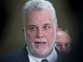Quebec Premier Philippe Couillard addresses reporters at a news conference Jan. 27, 2017.
