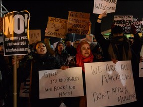 NEW YORK, NY - JANUARY 28: Protestors rally during a demonstration against the new immigration ban issued by President Donald Trump at John F. Kennedy International Airport on January 28, 2017 in New York City. President Trump signed the controversial executive order that halted refugees and residents from predominantly Muslim countries from entering the United States.