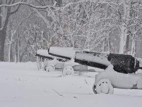 Old cannons lay under a heavy coat of snow on the historic Plains of Abraham, as a heavy snowfall hit the region, Thursday, December 1, 2016 in Quebec City. THE CANADIAN PRESS/Jacques Boissinot