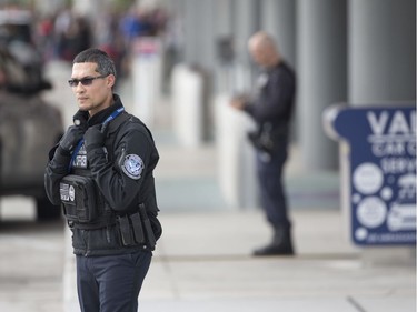 Security personnel stand guard outside Fort Lauderdale–Hollywood International Airport, Friday, Jan. 6, 2017, in Fort Lauderdale, Fla. A gunman opened fire in the baggage claim area at the airport Friday, killing several people and wounding others before being taken into custody in an attack that sent panicked passengers running out of the terminal and onto the tarmac, authorities said.