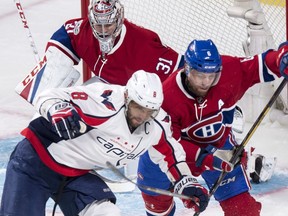 Montreal Canadiens defenceman Shea Weber (6) takes Washington Capitals left wing Alex Ovechkin (8) out from in front of goalie Carey Price (31) during first period NHL hockey action Monday, January 9, 2017 in Montreal.