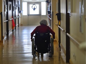 A elderly woman is seen in the hallway of a nursing home in this 2017 file photo.