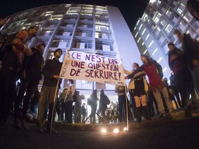 Demonstrators hold a  vigil at Université Laval for survivors of sexual assault.