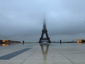 Photo of the day: The Eiffel Tower is blanketed in fog on a Paris morning, Jan. 31, 2017.