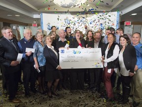 Twenty eight members of a same Quebec family celebrate after receiving their cheques sharing a $60-million lottery win, Thursday, Jan. 12, 2017 in Montreal, the biggest prize awarded ever by Loto-Québec.