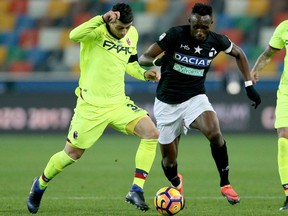 Bologna's Blerim Dzemaili, left, battles Udinese's Seko Fofana during Italian Serie A soccer match on Dec. 5, 2016. Dzemaili will become the Impact's new designated player for the 2017 MLS season, replacing Didier Drogba.