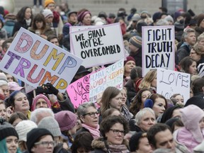 Hundreds of people gathered in support of the Women's March on Washington at Place des arts on Saturday.