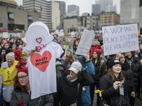 People gather in support of the Women's March on Washington at Place-des-Arts in Montreal on Saturday, January 21, 2017.