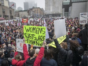 People gather in support of the Women's March on Washington at Place des Arts in Montreal on Saturday, January 21, 2017.