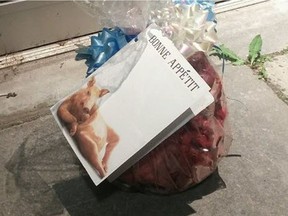 Worshipers at the Centre Culturel Islamique de Québec mosque in  Quebec City were surprised to see a pig's head left in front of one of the doors, wrapped with bows and ribbon, and a card that said 'bonne appetit.'