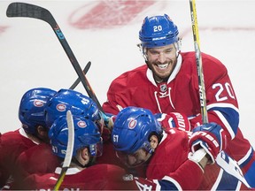 Canadiens captain Max Pacioretty (67) celebrates with teammates Zach Redmond (20), Mark Barberio (45) and Alexander Radulov (47) after scoring against the New York Rangers during third period NHL hockey action in Montreal, Saturday, Jan. 14, 2017.