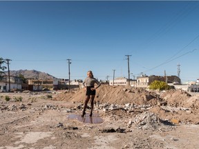 Teresa Margolles's Pista de baile del club "Mona Lisa" (Dance Floor From the "Mona Lisa" Nightclub) shows a transgender sex worker standing on the ruins of the dance floor of a demolished club in Ciudad Juarez, Mexico.