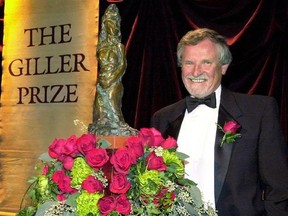 Author Richard B. Wright smiles after winning the Giller Prize for fiction in Toronto on November 6, 2001. Award-winning Canadian author Wright has died at the age of 79, his agent says.THE CANADIAN PRESS/Aaron Harris