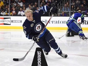 Winnipeg Jets&#039; Patrik Laine, left, skates against Vancouver Canucks&#039; Bo Horvat during the Fastest Skater portion of the NHL All-Star Skills Competition, Saturday, Jan. 28, 2017, in Los Angeles. Laine, Toronto Maple Leafs centre Nazem Kadri and Edmonton Oilers centre Connor McDavid are the NHL&#039;s three stars of the week. THE CANADIAN PRESS/AP/Mark J. Terrill