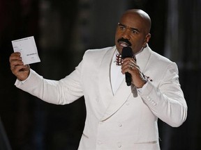 FILE - In this Dec. 20, 2015, file photo, Steve Harvey holds up the card showing the winners after he incorrectly announced Miss Colombia Ariadna Gutierrez at the winner at the Miss Universe pageant in Las Vegas. After an apparent envelope mix-up led Beatty and co-presenter Faye Dunaway to hand out the Oscars&#039; best picture award to ‚ÄúLa La Land‚Äù instead of the real winner, ‚ÄúMoonlight,‚Äù on Feb. 26, 2017, Harvey tweeted: ‚ÄúCall me Warren Beatty. I can help you get through this!‚Äù (AP Phot