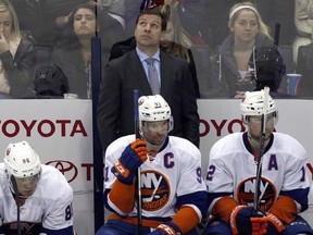 New York Islanders interim head coach Doug Weight, top, is seen during an NHL hockey game against the Columbus Blue Jackets in Columbus, Ohio, Saturday, Feb. 25, 2017. Weight has made at least one prominent change with the New York Islanders since he replaced Jack Capuano behind the bench last month: he&#039;s expanded the role of his best player. THE CANADIAN PRESS/AP/Paul Vernon